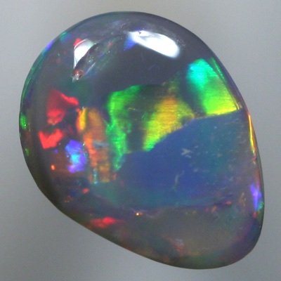 SOLID SEMI BLACK OPAL Large rainbow rolling flashes. Bright.